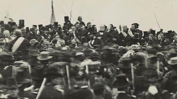 vintage black and white photo with Lincoln visible amidst a large crowd of people