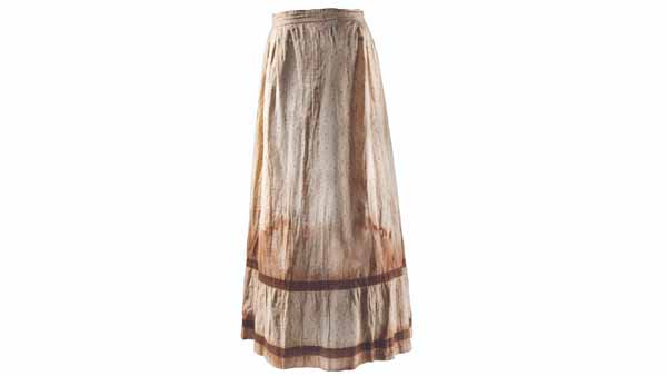 photograph of a white skirt that appears stained