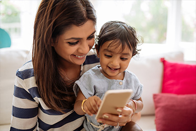 kids talking to a parent through a mobile device
