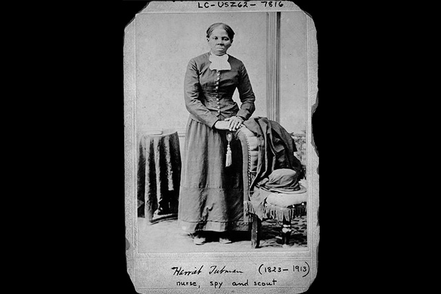 Jasmine holding up a photograph of Harriet Tubman