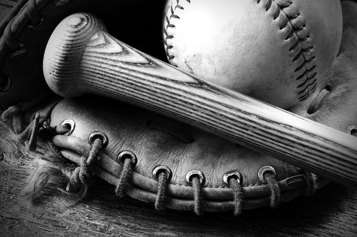 black and white photograph of a baseball, bat and glove