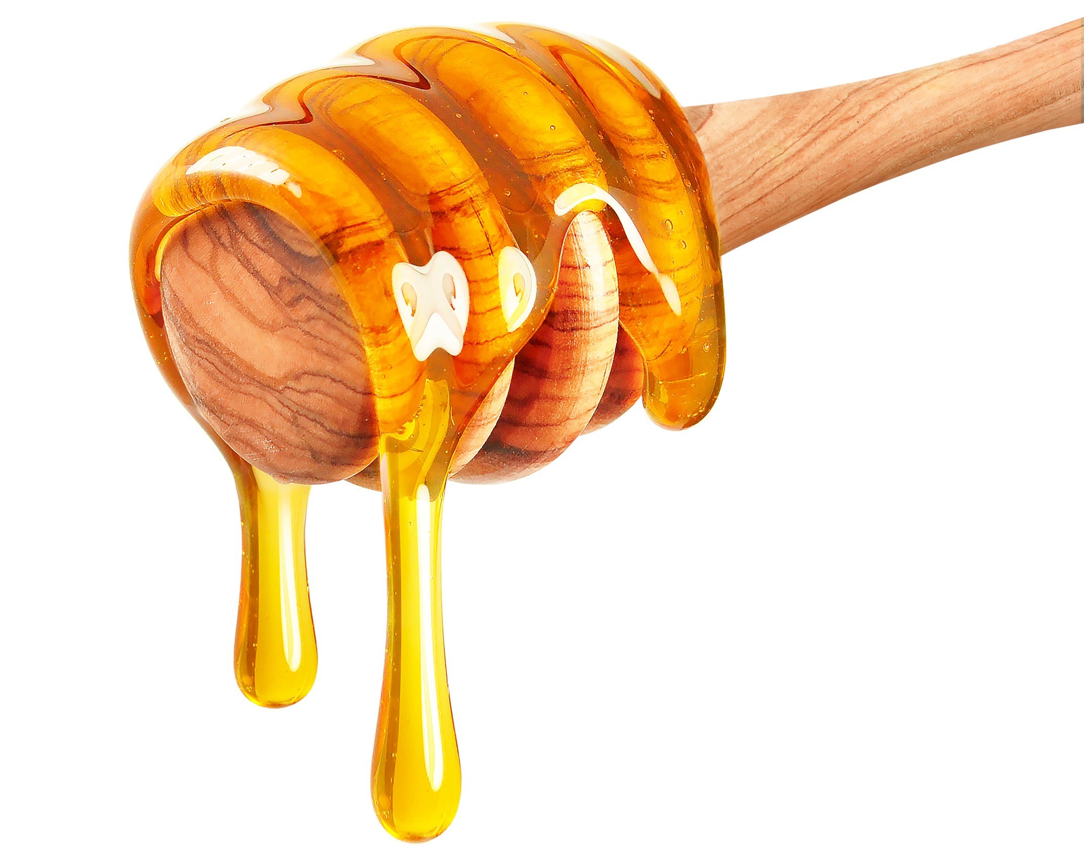 Honey drips from a wooden dipper stick.