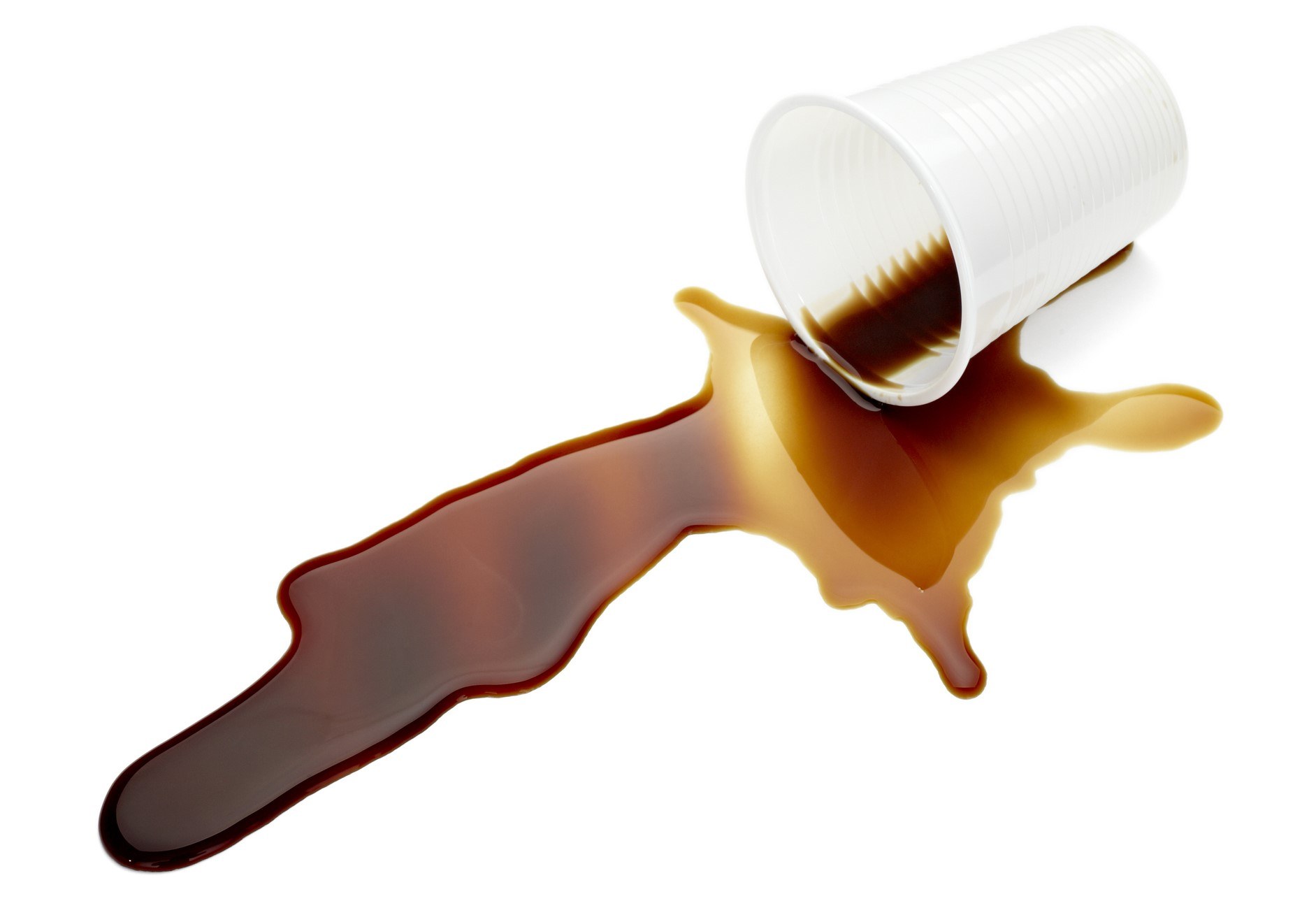 Coffee spilled from a plastic cup that tipped over.